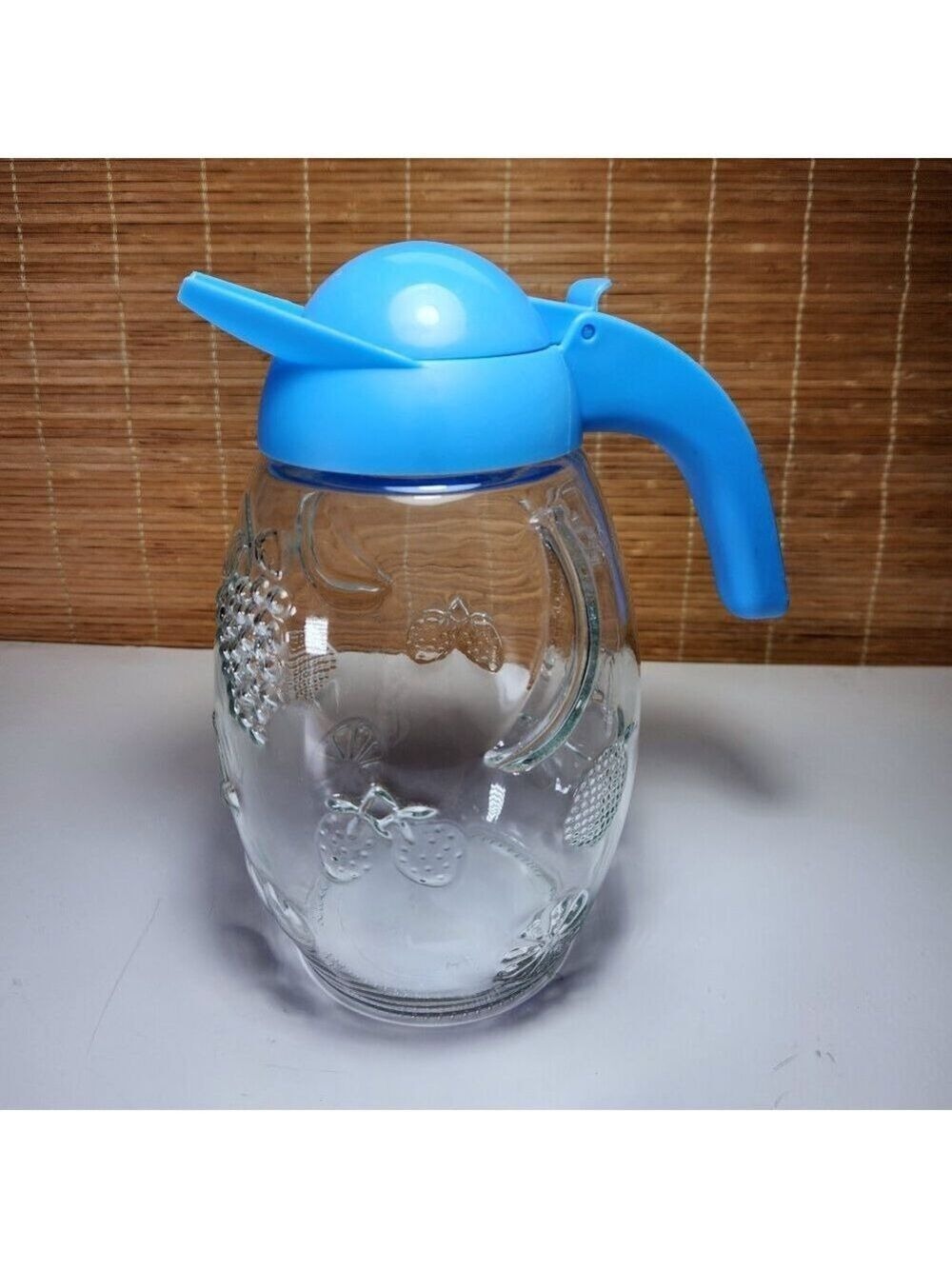 Solmaz Mercan Glass Juice Pitcher with Blue Lid Embossed Fruit Pattern Vintage